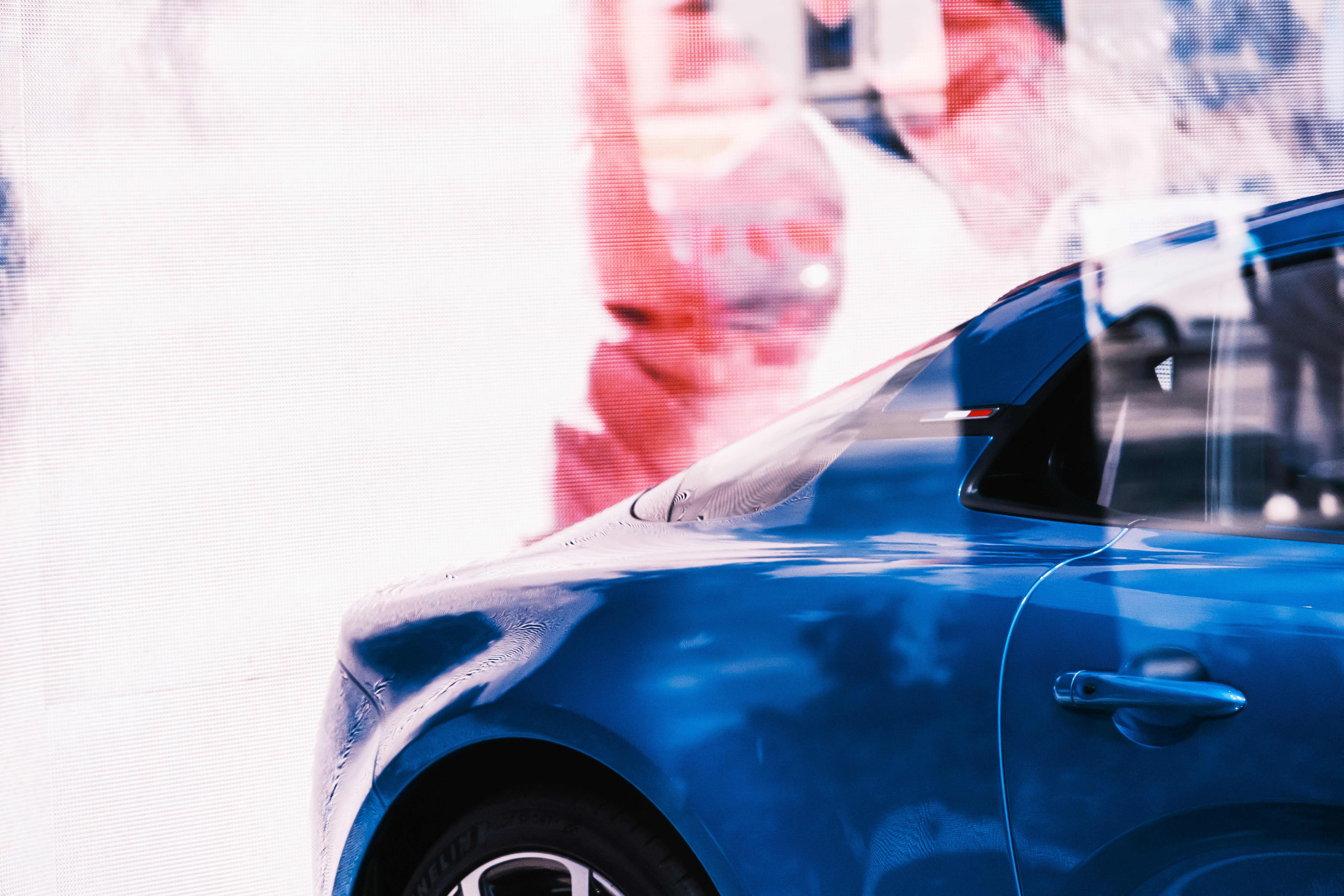 blue car on snow covered road during daytime